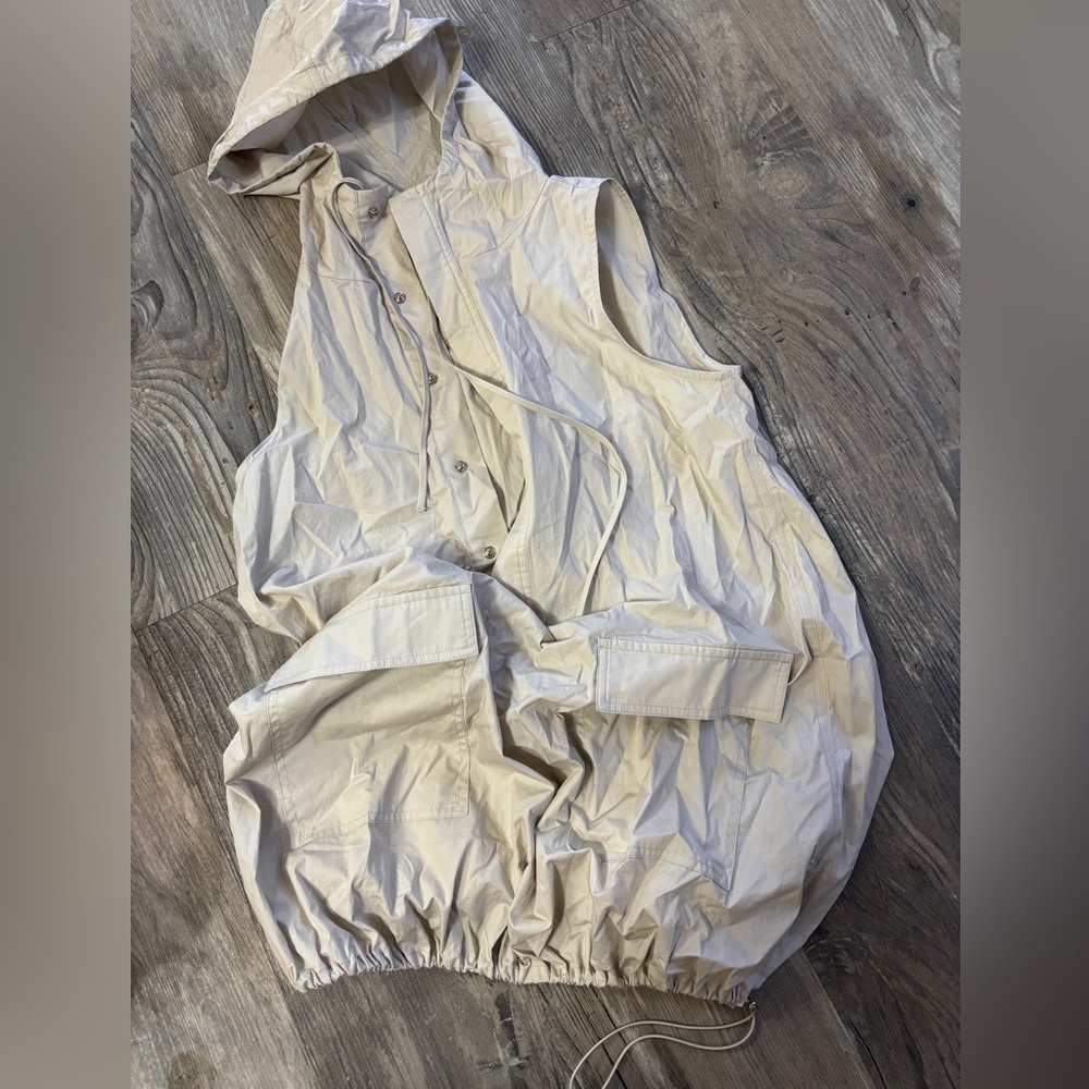 Cream beige vest dress that can be made loose or tight at the bottom